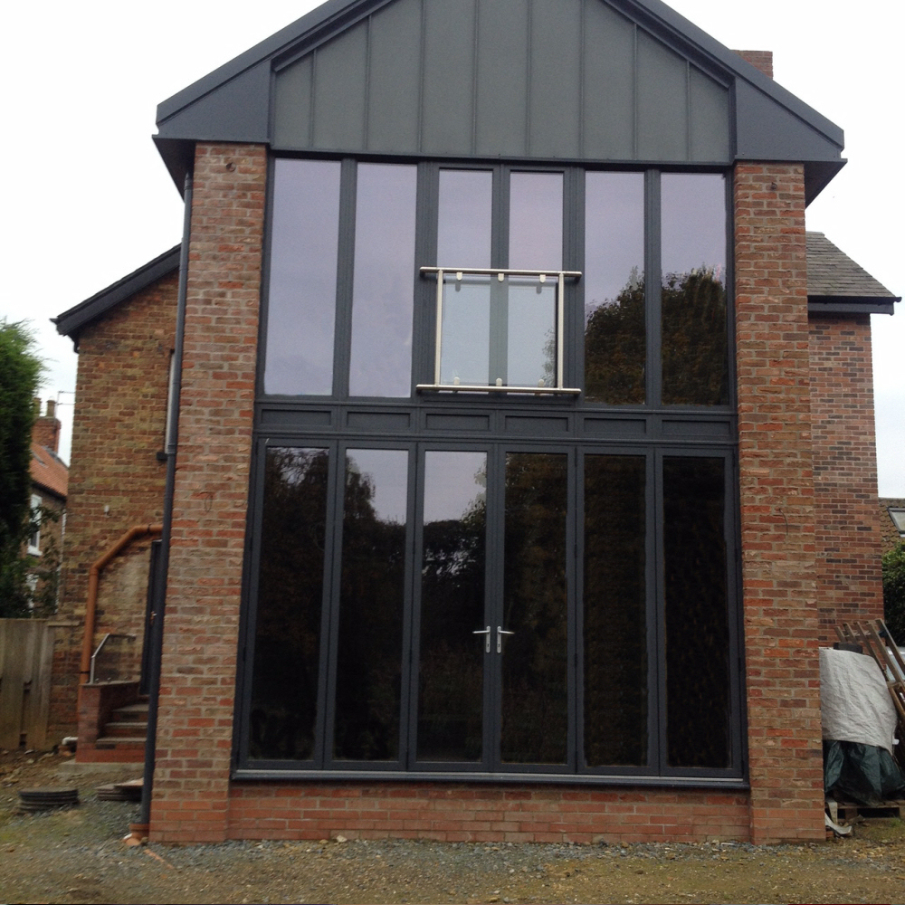 Double height Aluminium Frames With French Doors And Juliet.